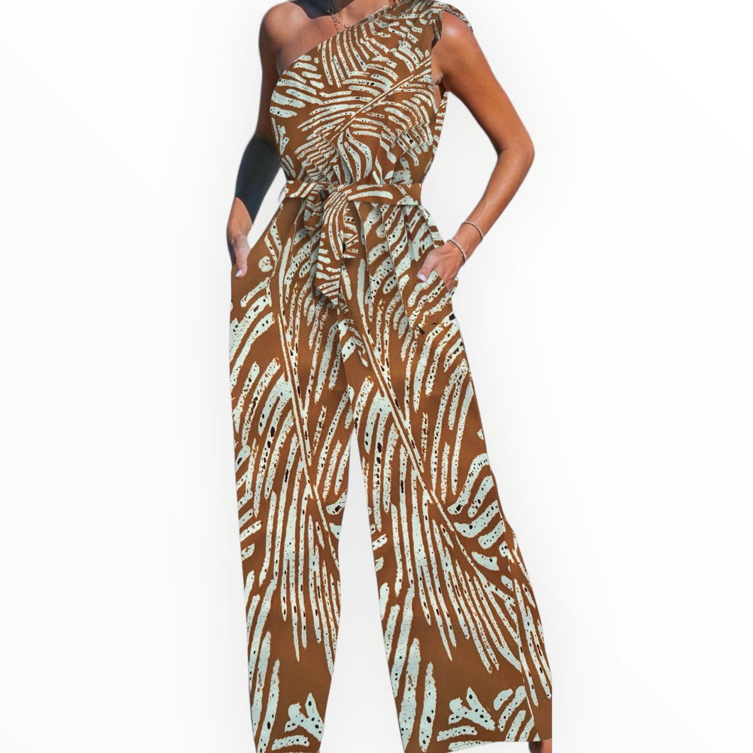 Lana asymmetric monstera jumpsuit with pockets and adjustable straps.