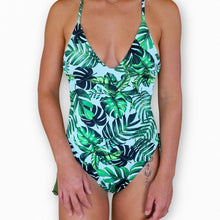 Load image into Gallery viewer, Meli reversible one piece with details on the side. Model is wearing a small.

